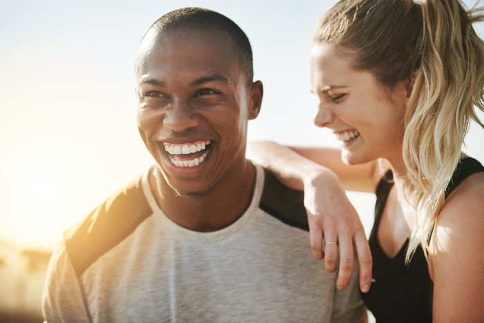 young man and woman laughing