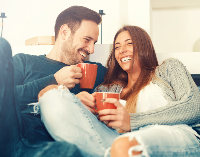 young man and woman smiling