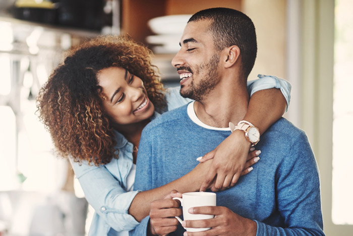young couple smiling at each other
