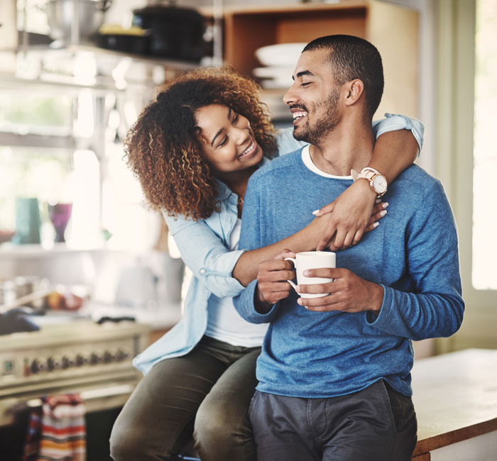 young couple smiling at each other