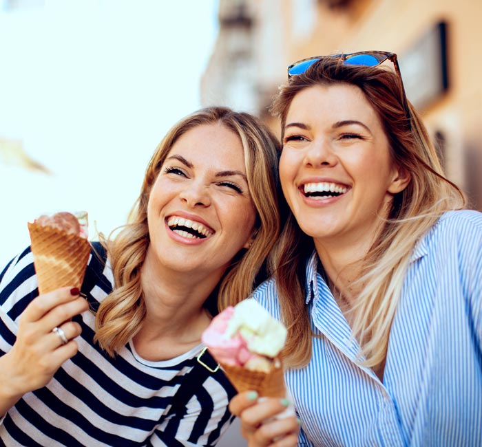 two woman smiling