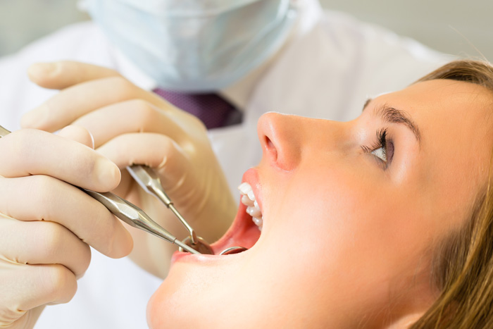 young woman receiving an oral exam
